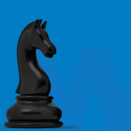 A black chess piece sitting on top of a blue background.