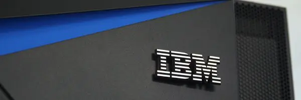 The ibm logo is seen on a black and blue computer.