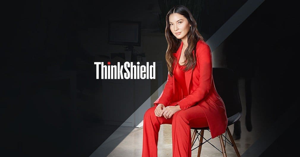 A woman in red sitting on a chair with the word thinkshield.